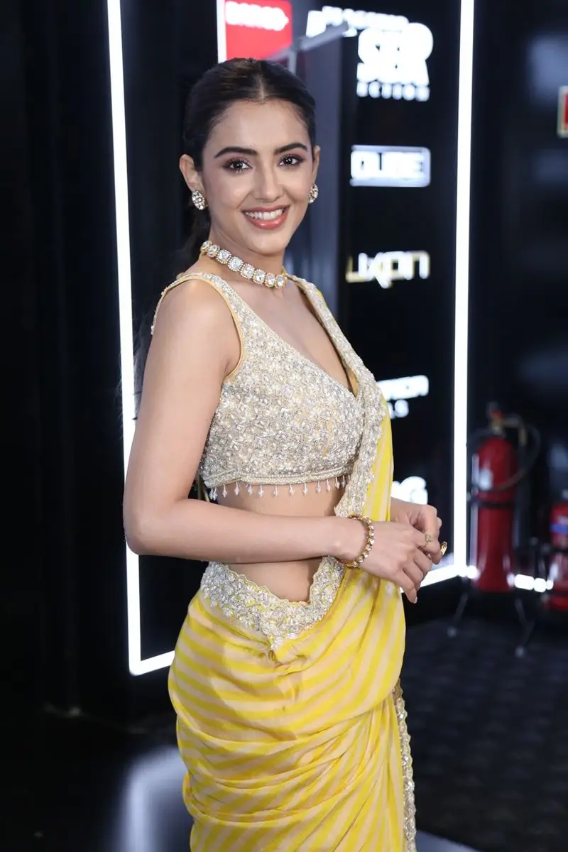 TELUGU ACTRESS MALVIKA SHARMA IN YELLOW SAREE SLEEVELESS BLOUSE 6